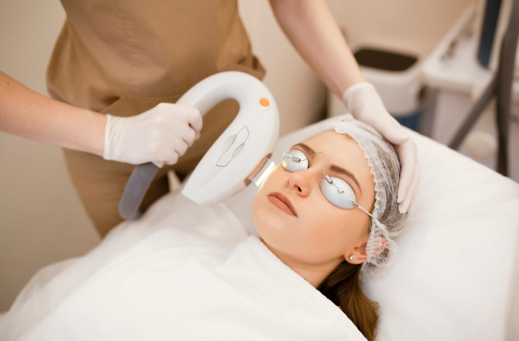 Woman laying down on a bed receiving ipl treatment for dry eye