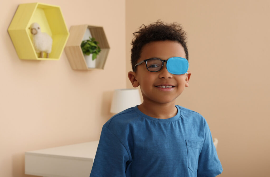 Young boy wearing an occluder on his glasses.